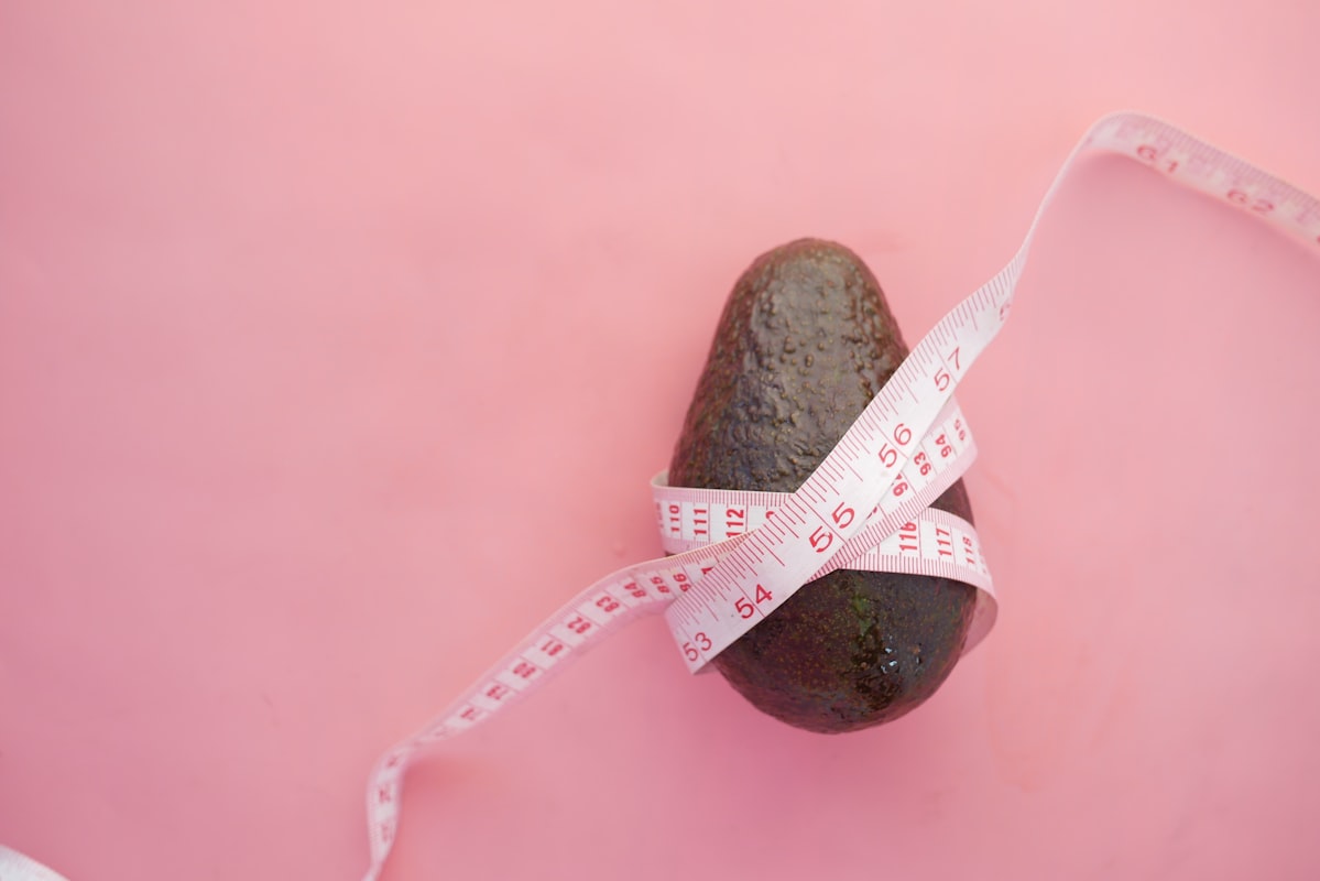 Healthy cholesterol-friendly foods including vegetables, fish, and whole grains