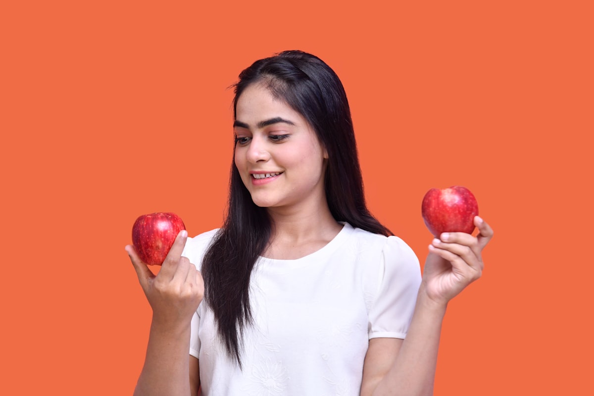 Person preparing healthy meal with fresh vegetables and whole grains